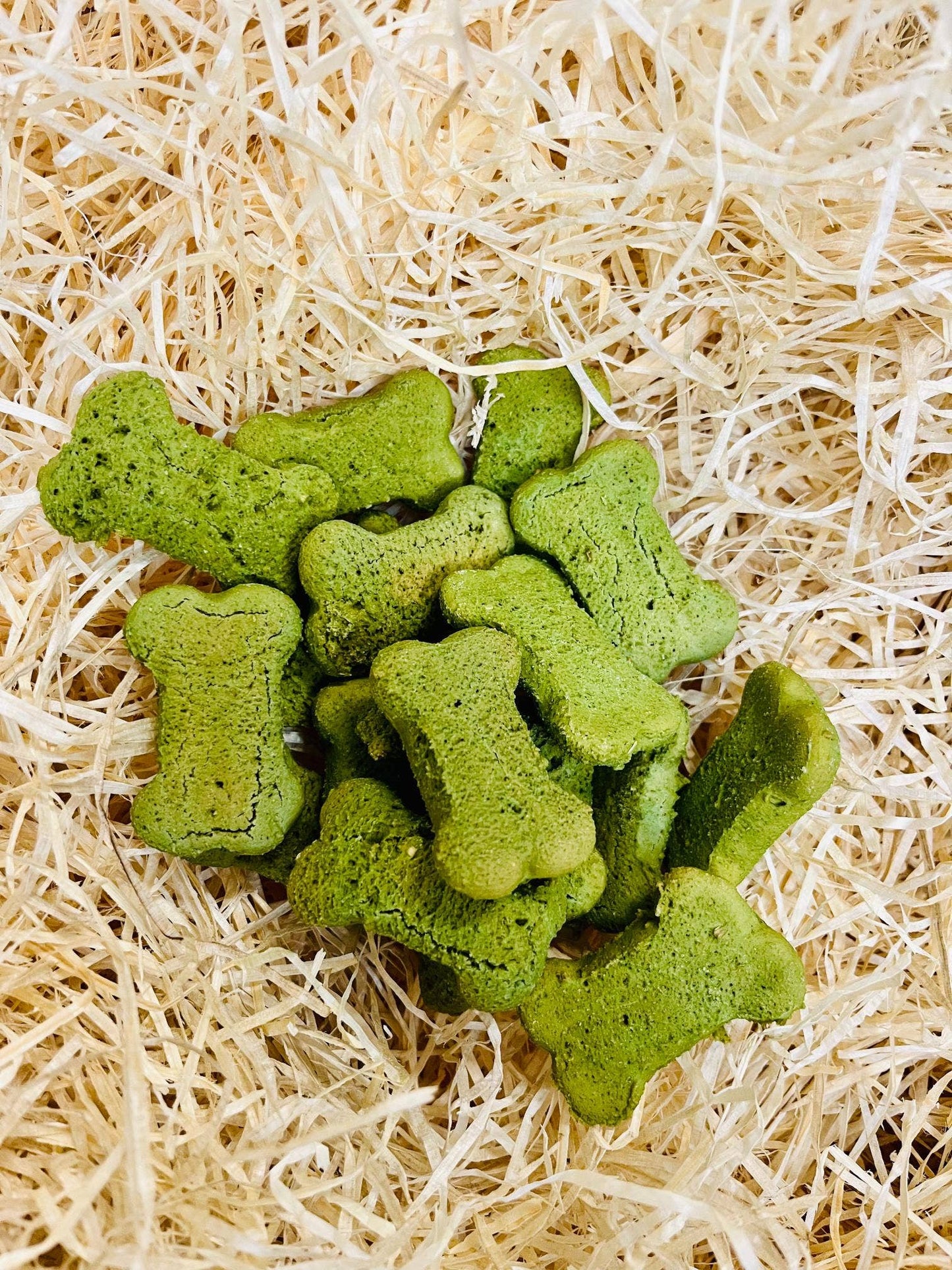 Minty Breath Bones dog treats displayed loose, fun bone-shaped grain-free chews with natural mint flavour.