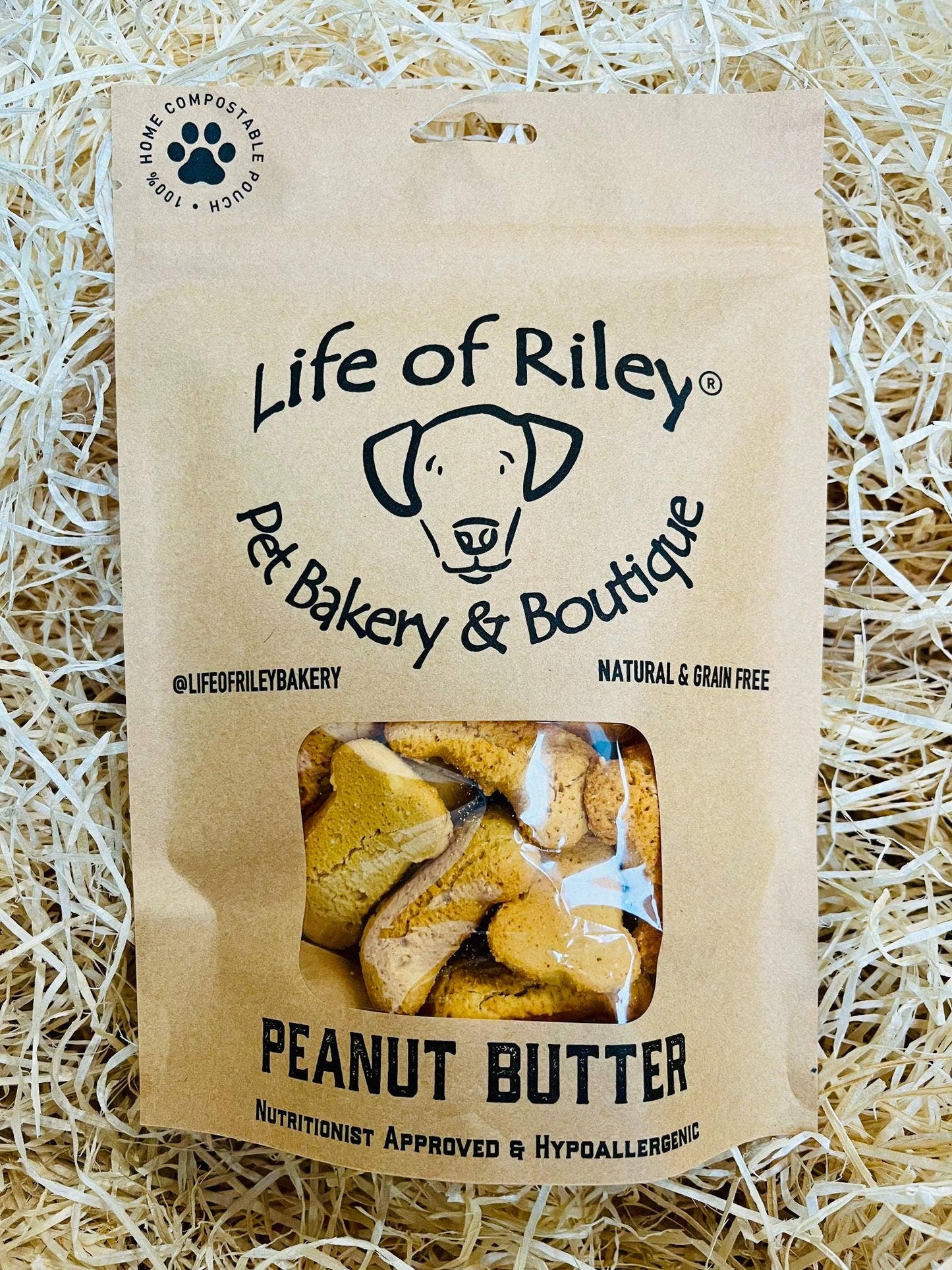 Peanut Butter Bones for dogs in retail packaging, grain-free natural dog treats made with real peanut butter.