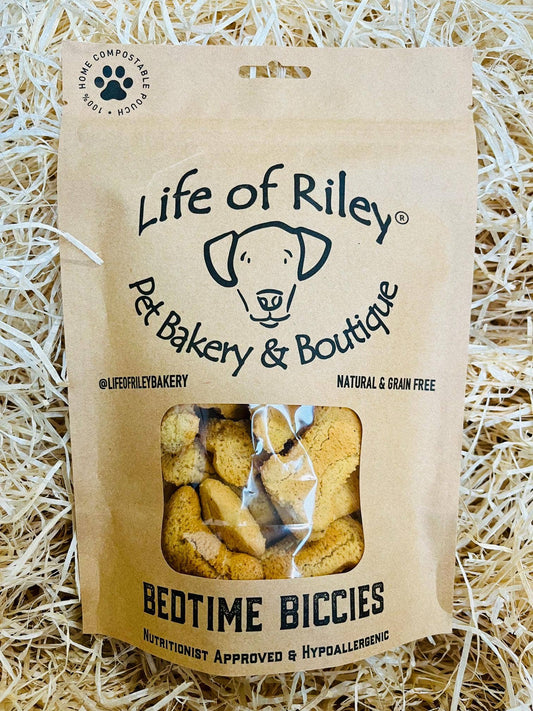 Bedtime Biscuits calming dog treats in a retail , grain-free peanut butter base with chamomile and valerian.