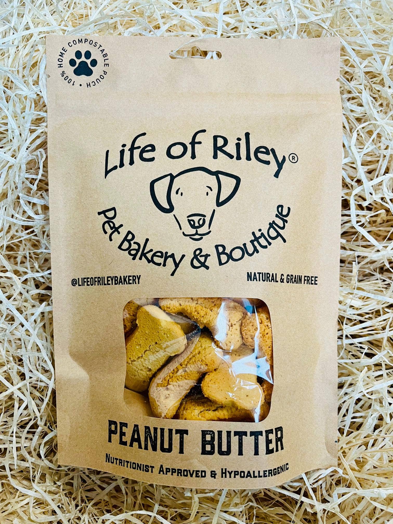 Peanut Butter Bones for dogs in retail packaging, grain-free natural dog treats made with real peanut butter.