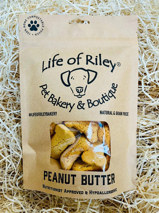 Peanut Butter Bones for dogs in retail packaging, grain-free natural dog treats made with real peanut butter.