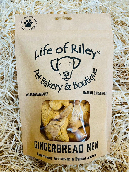 Mini Gingerbread Men dog treats in a retail pack, grain-free peanut butter and ginger biscuits for dogs.