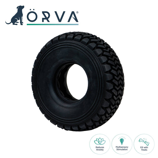 A black rubber dog toy shaped like a tire with the ÖRVA brand logo and icons indicating it's made from recycled materials and suitable for dogs.