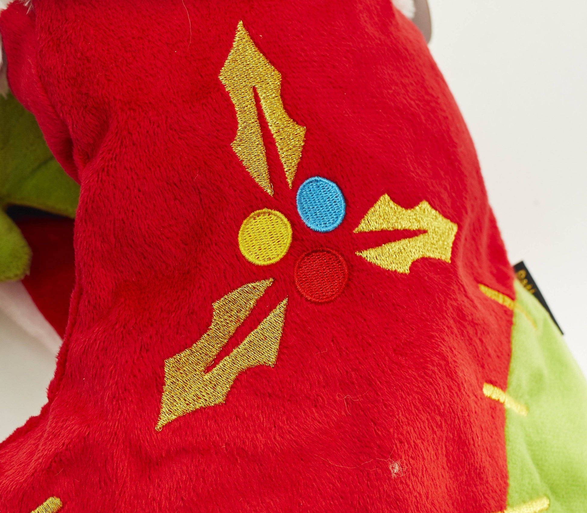Embroidered holly detail on red and green PetLondon Christmas dog stocking